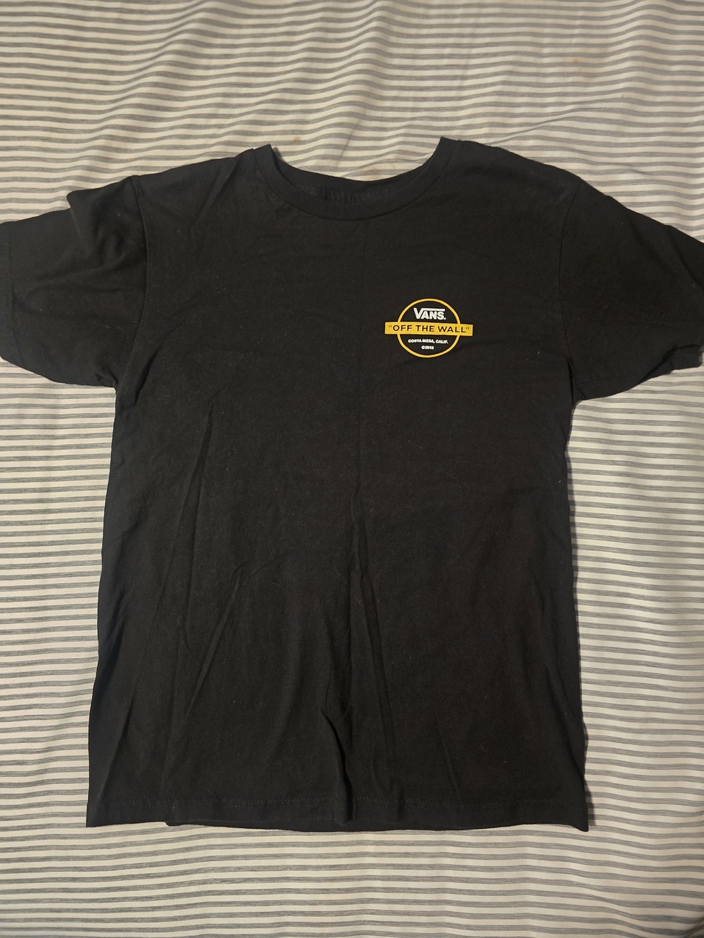 Vans Black Tee with Yellow 'Off The Wall' Chest Logo